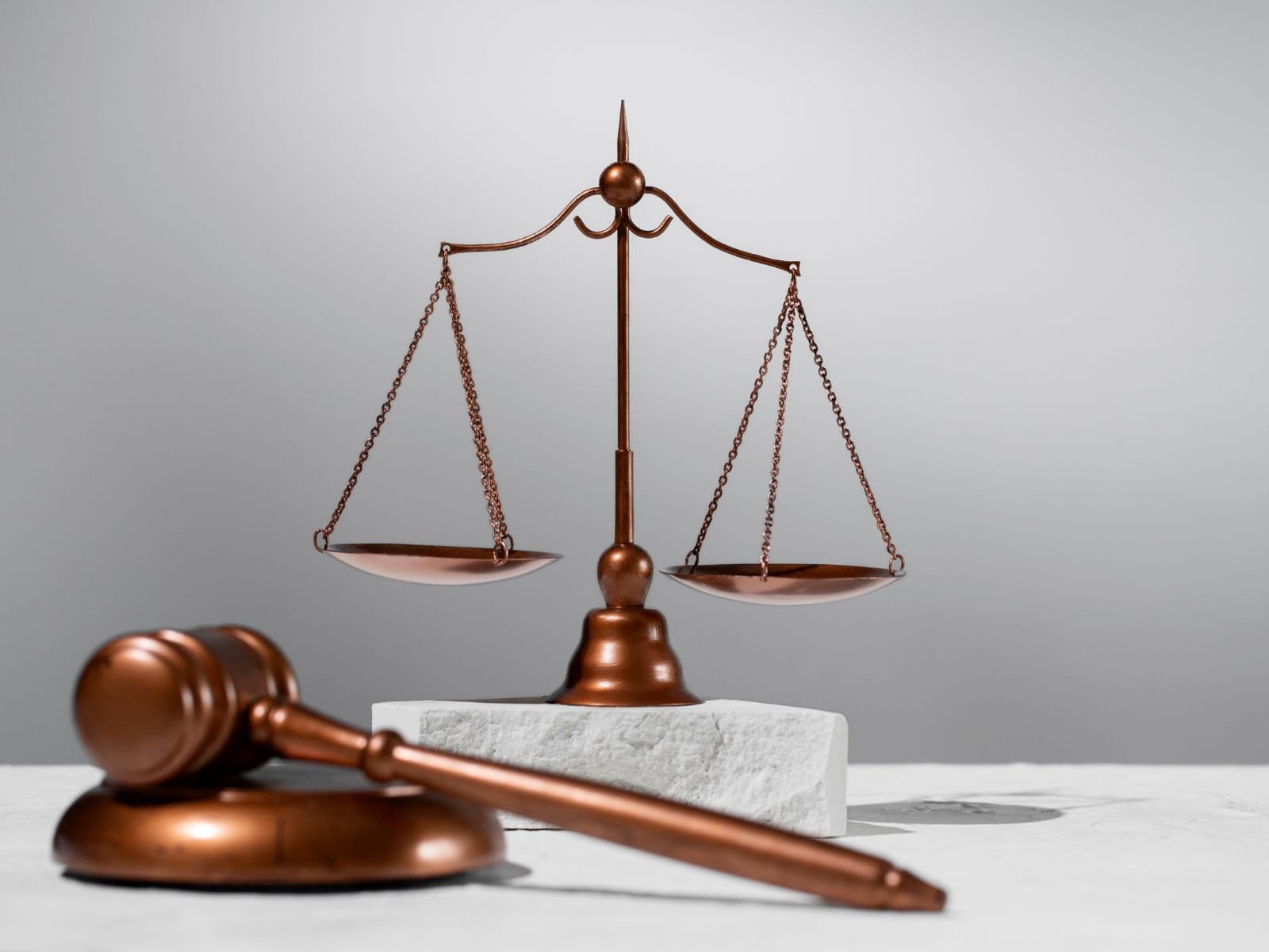 Scales of justice beside a judge's gavel